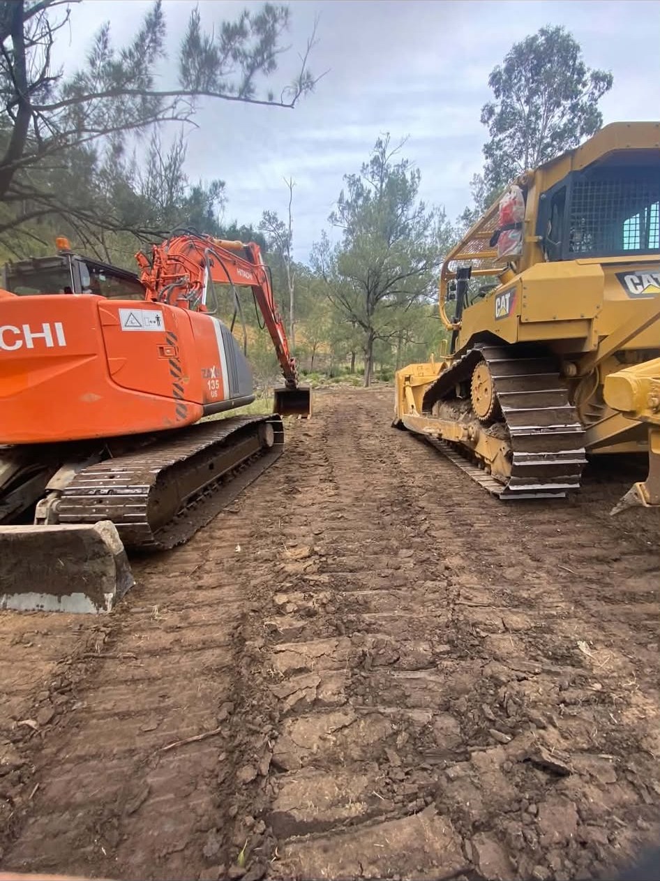 Kirkman excavator and dozer on a cleared job